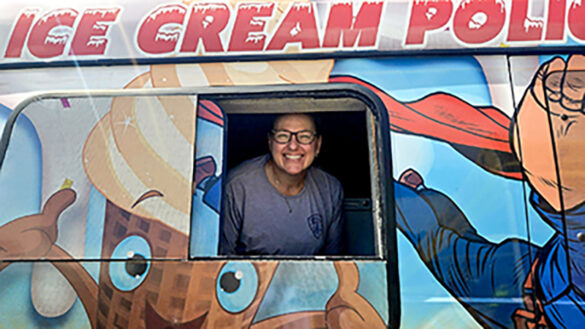 2 Denise Zabarsky hands out ice cream from a van modified for ice cream
