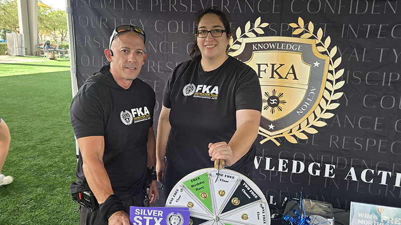 Alexis Blasenhiem and Carlos Gelpi of Family Knowledge Action a martial arts center in Margate at the International Festival