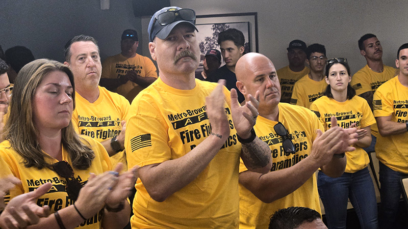 Margate Fire fighters cheer as union leaders speak in favor of mering with BSO during a workshop at Margate City Hall