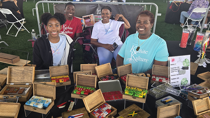 The Kushnite Kulture home based business in Margate makes handmade dominoes. Left to right Kafi Marsh Pamela Samuel Amirah Marsh Jelani Marsh at the International Festival