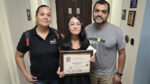 Adriana Hernandez, a sixth grader at Margate Middle was honored as athlete of the month for her efforts in cross country. She is pictured with her mother Perla Navarrete and father Roberto Hernandez.